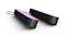 Two slim black smart light bars glowing with soft pink illumination Two slim black smart light bars glowing with soft pink illumination