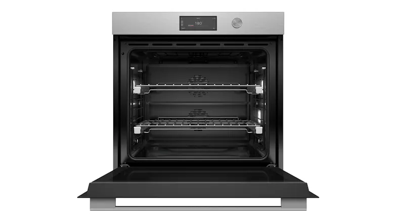 Front view of the built-in oven in brushed silver. The oven door is open, revealing two racks and a black interior Front view of the built-in oven in brushed silver. The oven door is open, revealing two racks and a black interior