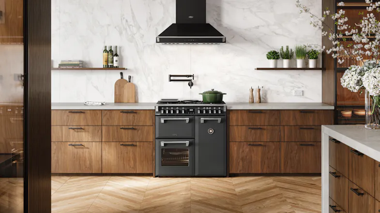 A modern kitchen with a range oven and wood cabinetry A modern kitchen with a range oven and wood cabinetry