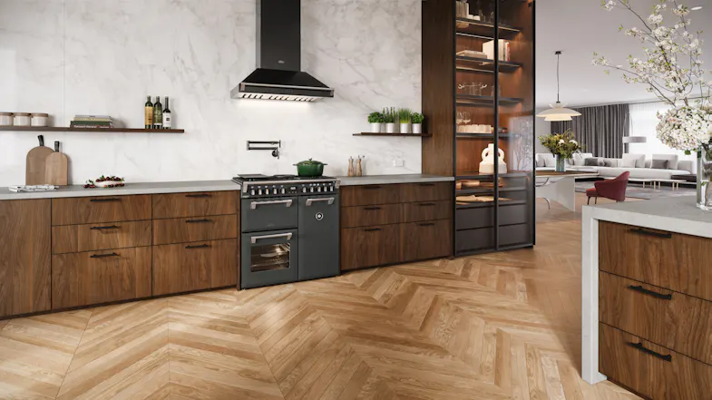A contemporary kitchen with a range oven and marble walls A contemporary kitchen with a range oven and marble walls