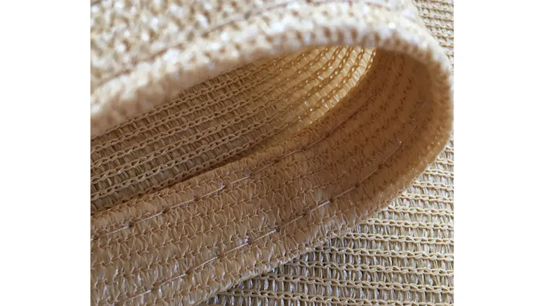 Close-up of beige woven fabric used for Kmall rectangular sunshade sail, showing durable stitching Close-up of beige woven fabric used for Kmall rectangular sunshade sail, showing durable stitching