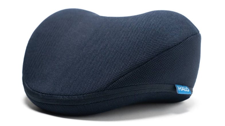 Close-up of the HALO Orthopaedic Neck Stretch Pillow in dark navy blue Close-up of the HALO Orthopaedic Neck Stretch Pillow in dark navy blue