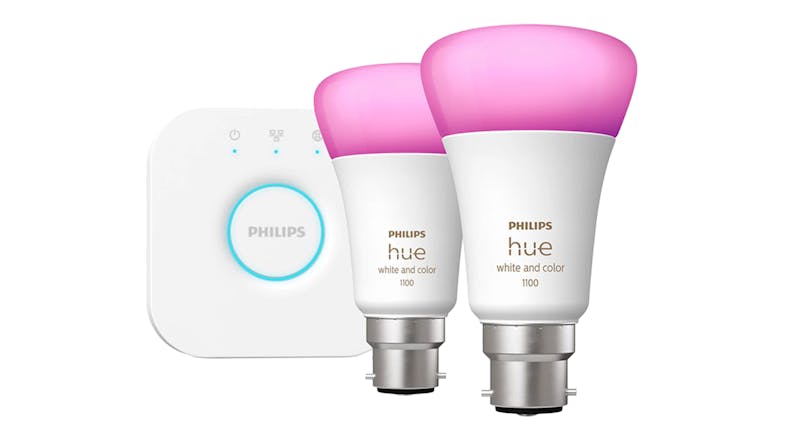 Two Philips light bulbs alongside a Hue bridge Two Philips light bulbs alongside a Hue bridge