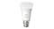 A Philips Hue light bulb emitting white light A Philips Hue light bulb emitting white light