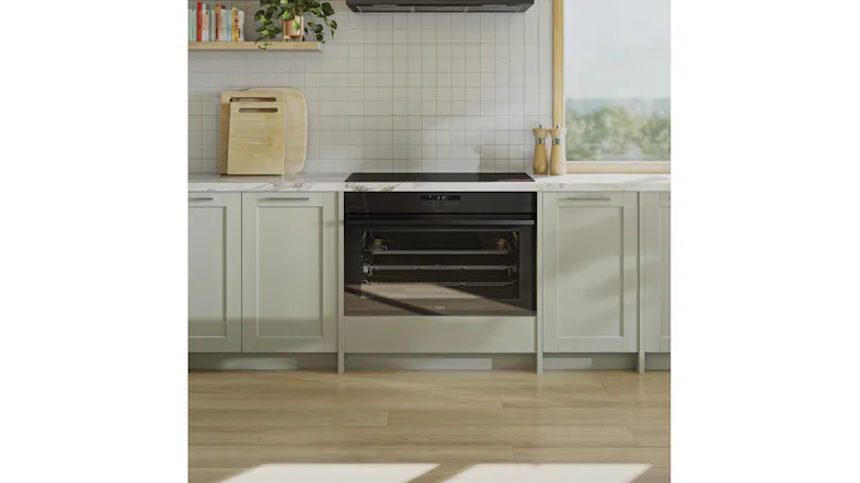 Built-in oven under cooktop in grey kitchen with tile backsplash Built-in oven under cooktop in grey kitchen with tile backsplash