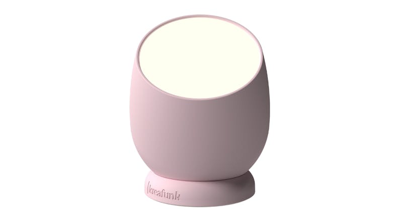 Pink Kreafunk Beam wireless dimmable lamp with round design and angled light surface on a rotating base Pink Kreafunk Beam wireless dimmable lamp with round design and angled light surface on a rotating base