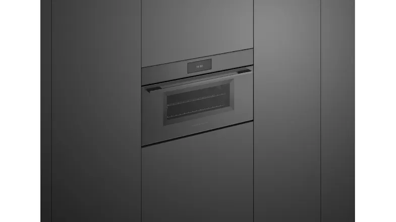 Steam oven in matte black kitchen with a digital display Steam oven in matte black kitchen with a digital display