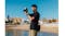Photographer using the Canon Mirrorless Camera to take a picture of a coastal town and beach Photographer using the Canon Mirrorless Camera to take a picture of a coastal town and beach