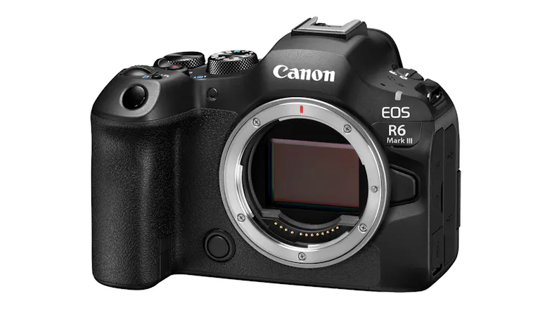 Angled front view of the Canon Mirrorless Camera, showing the mode dial and top controls Angled front view of the Canon Mirrorless Camera, showing the mode dial and top controls