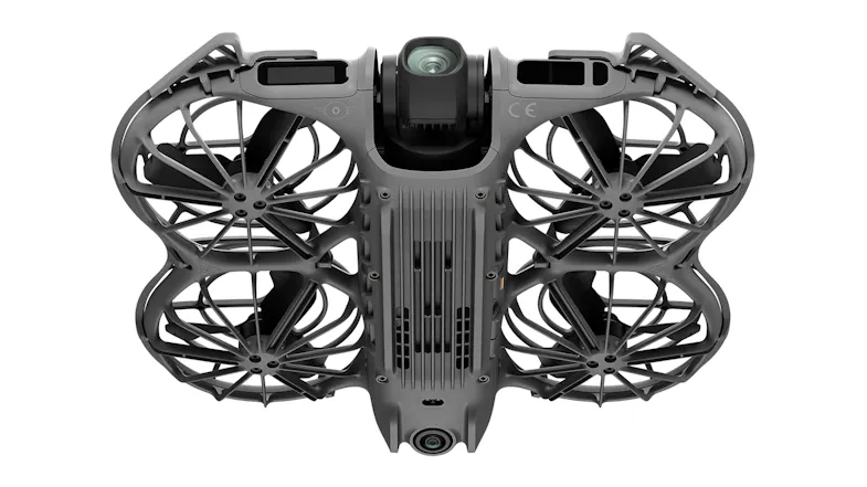Underside view of drone with protective cage and gimbal-mounted camera Underside view of drone with protective cage and gimbal-mounted camera