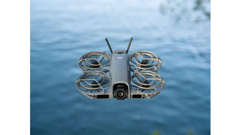 DJI Neo 2 drone hovering near water DJI Neo 2 drone hovering near water