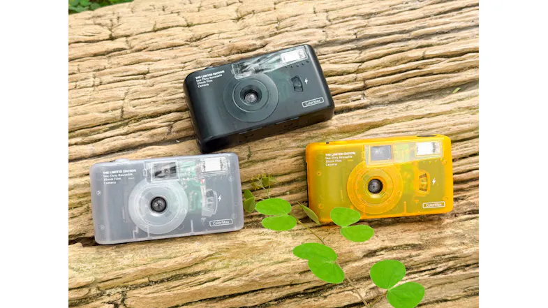 Three film cameras in black, white, and yellow Three film cameras in black, white, and yellow
