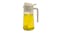 Clear glass oil dispenser with white lid and handle, filled with yellow cooking oil Clear glass oil dispenser with white lid and handle, filled with yellow cooking oil