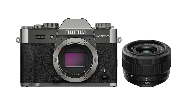 Fujifilm X-T30 III camera body in charcoal silver, next to an XC 13-33mm f/3.5-6.3 OIS lens Fujifilm X-T30 III camera body in charcoal silver, next to an XC 13-33mm f/3.5-6.3 OIS lens