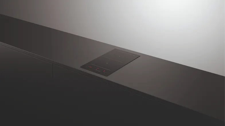 Two-zone induction cooktop on a dark counter Two-zone induction cooktop on a dark counter