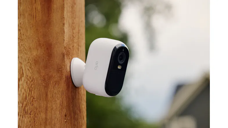 Arlo camera on a wooden post with house siding Arlo camera on a wooden post with house siding