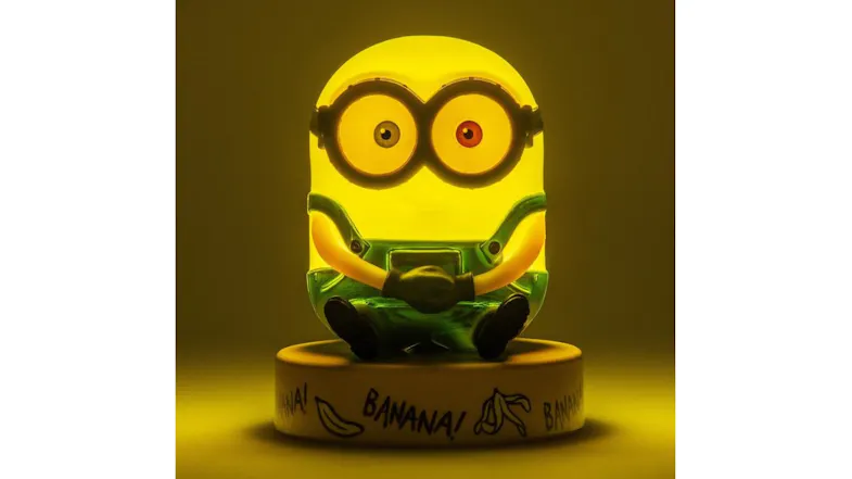 Illuminated Bob the Minion LED icon light with a yellow glow, sitting on a round base Illuminated Bob the Minion LED icon light with a yellow glow, sitting on a round base