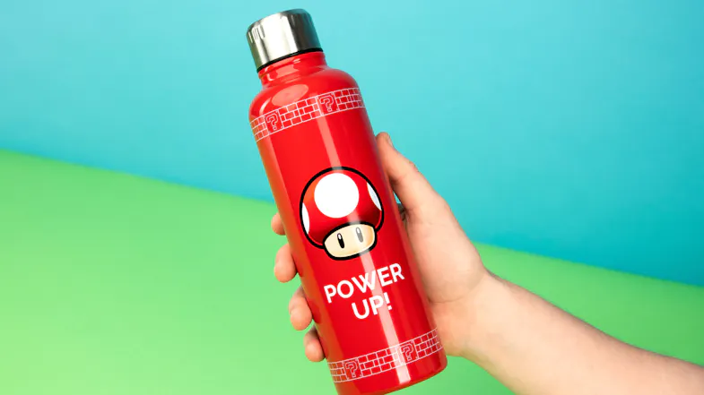 A person holding a Super Mario metal water bottle A person holding a Super Mario metal water bottle