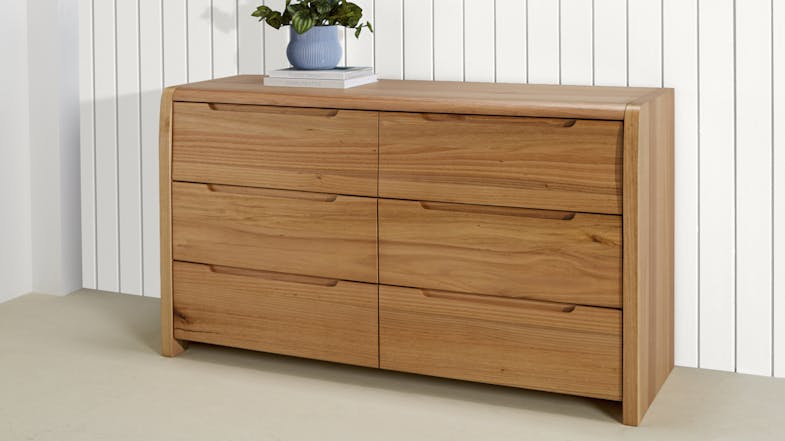 Modern 6-drawer lowboy with all drawers closed, featuring smooth curved edges and a clean, minimalist design Modern 6-drawer lowboy with all drawers closed, featuring smooth curved edges and a clean, minimalist design