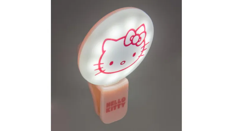 Illuminated Hello Kitty clip-on selfie light glowing brightly Illuminated Hello Kitty clip-on selfie light glowing brightly