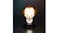 Illuminated Pennywise Icon Light on a black base, glowing brightly in a dark setting Illuminated Pennywise Icon Light on a black base, glowing brightly in a dark setting