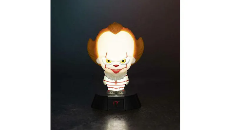 Illuminated Pennywise Icon Light on a black base, glowing brightly in a dark setting Illuminated Pennywise Icon Light on a black base, glowing brightly in a dark setting