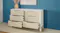 White cabinet with open grooved drawers White cabinet with open grooved drawers