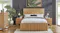 Complete slatted wood bedroom set with dark panelled walls and a large indoor plant Complete slatted wood bedroom set with dark panelled walls and a large indoor plant