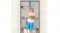 Person in yellow top and blue skirt holding cupcakes, standing in doorway with black mesh curtain and a dog Person in yellow top and blue skirt holding cupcakes, standing in doorway with black mesh curtain and a dog