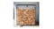 A view of the firewood rack positioned in a shaded area outside, with lots of wood stacked neatly in it A view of the firewood rack positioned in a shaded area outside, with lots of wood stacked neatly in it