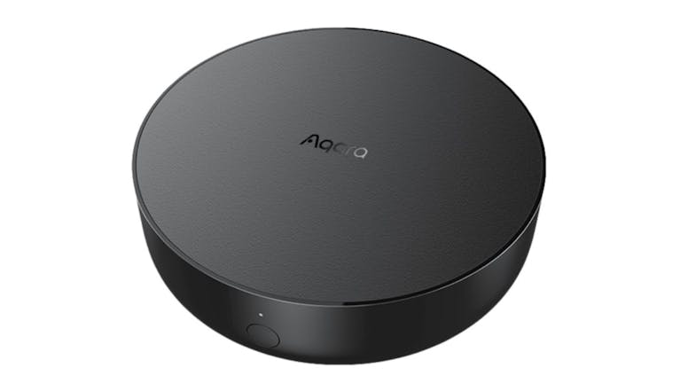 Black circular Aqara Hub M2 smart home device with a smooth top and a small button on the front Black circular Aqara Hub M2 smart home device with a smooth top and a small button on the front