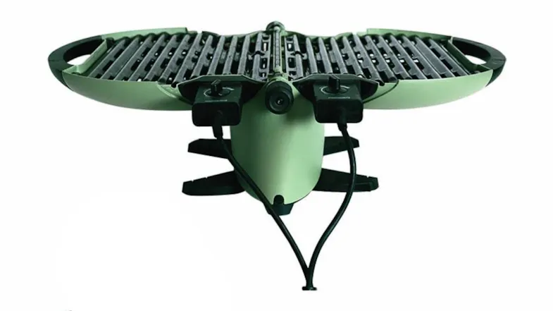 Open view of the nomadiQ Electric Barbecue in green, showing two separate grilling sections Open view of the nomadiQ Electric Barbecue in green, showing two separate grilling sections