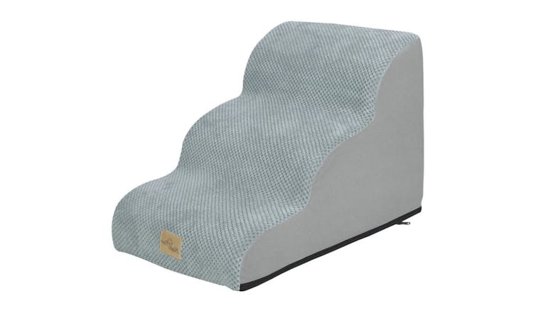 Light grey foam pet stairs with scalloped steps and textured fabric cover Light grey foam pet stairs with scalloped steps and textured fabric cover