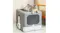 A portable litter box with an attached scoop and a cat resting on top in a modern indoor setting A portable litter box with an attached scoop and a cat resting on top in a modern indoor setting