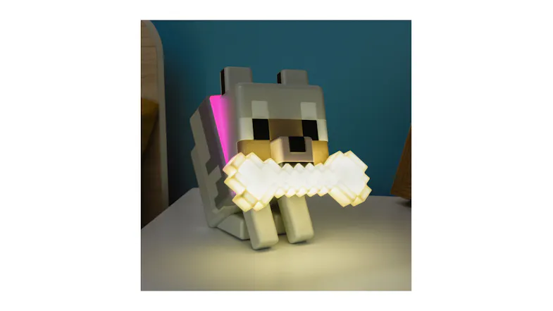 An angled side view of the globuddies light displayed and illuminated on a table An angled side view of the globuddies light displayed and illuminated on a table