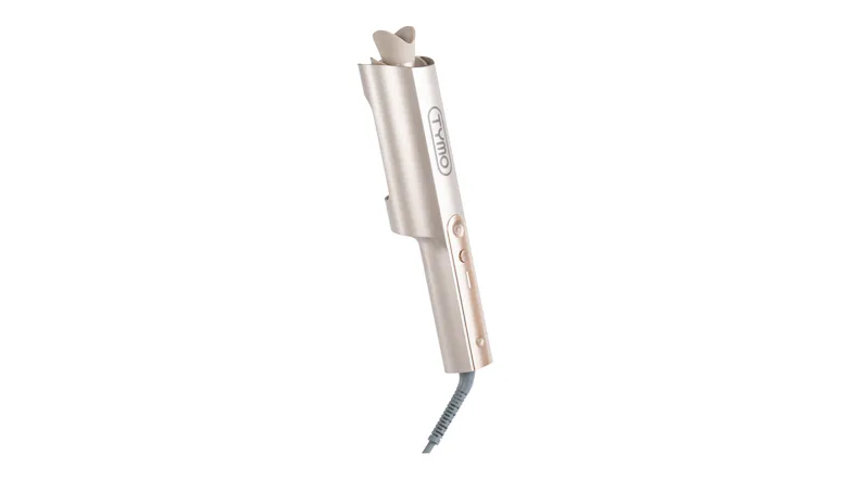 A gold TYMO curler with clamp and control buttons A gold TYMO curler with clamp and control buttons