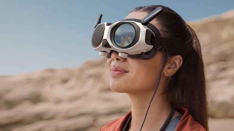 A close up view of a women wearing the vision goggles while glancing at the desert A close up view of a women wearing the vision goggles while glancing at the desert
