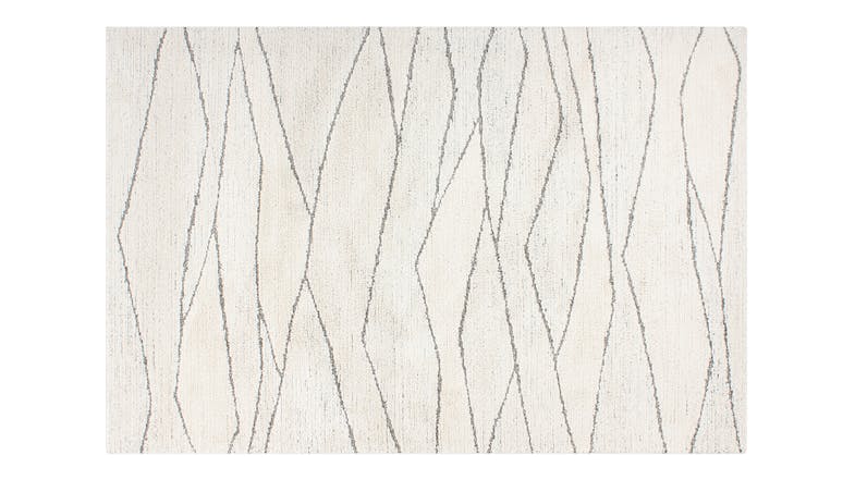Everest Rug in ecru with an abstract linear pattern of irregular vertical lines in soft silver tones Everest Rug in ecru with an abstract linear pattern of irregular vertical lines in soft silver tones