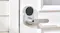 A close-up of the Aqara Smart Lock U300 installed on a white door A close-up of the Aqara Smart Lock U300 installed on a white door