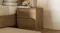 A contemporary Fawn Bedside Table with natural wood grain, showing two handle-less drawers A contemporary Fawn Bedside Table with natural wood grain, showing two handle-less drawers