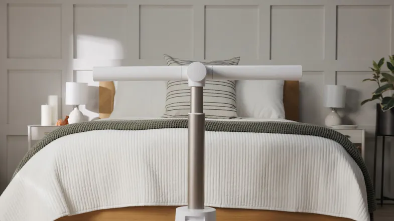 Fan ready to deliver wide cooling in a bedroom with white and wood accents Fan ready to deliver wide cooling in a bedroom with white and wood accents