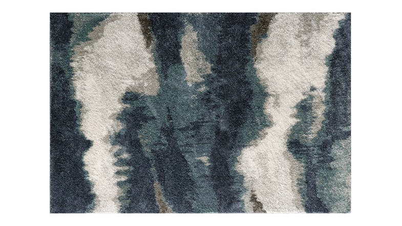 Full view of the Landon rug, showing its abstract design in blue and cream finish Full view of the Landon rug, showing its abstract design in blue and cream finish