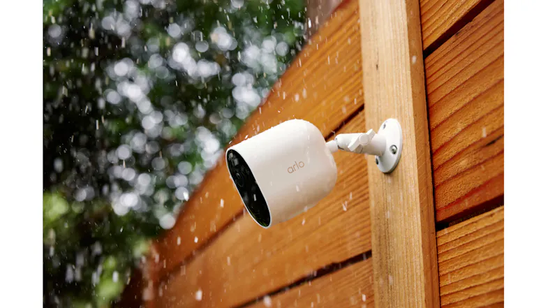 A view of the Arlo Security Camera attached to a wooden fence A view of the Arlo Security Camera attached to a wooden fence