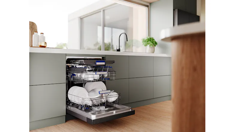 An open dishwasher with plates, bowls, glasses, and more An open dishwasher with plates, bowls, glasses, and more