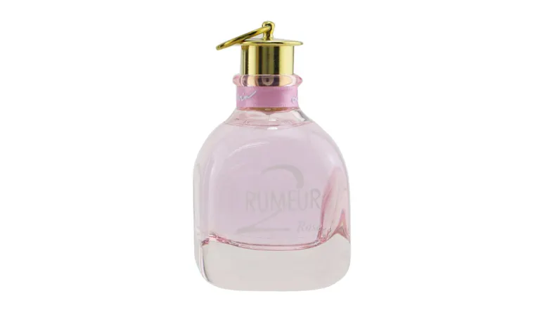 Pink Lanvin Rumeur 2 Rose perfume bottle with gold cap and pink ribbon around the neck Pink Lanvin Rumeur 2 Rose perfume bottle with gold cap and pink ribbon around the neck