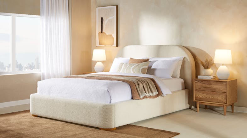 A Cove King upholstered gas lift storage bed frame in a modern bedroom setup A Cove King upholstered gas lift storage bed frame in a modern bedroom setup