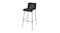 Black Levy Bar Stool with a smooth, curved seat and low backrest, supported by four slim metal legs with a footrest Black Levy Bar Stool with a smooth, curved seat and low backrest, supported by four slim metal legs with a footrest