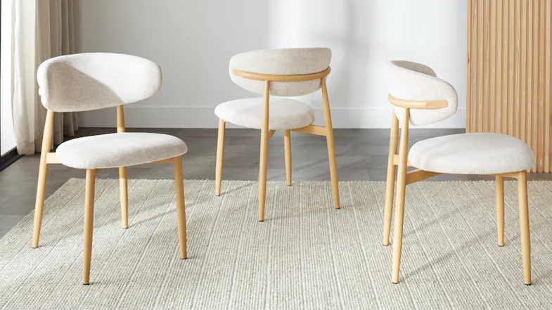 Three modern Ryder dining chairs with sleek frames and upholstered seats Three modern Ryder dining chairs with sleek frames and upholstered seats