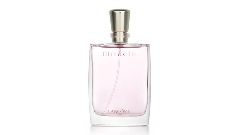A front view of a Lancôme Miracle Eau De Parfum Spray bottle filled with light pink liquid A front view of a Lancôme Miracle Eau De Parfum Spray bottle filled with light pink liquid