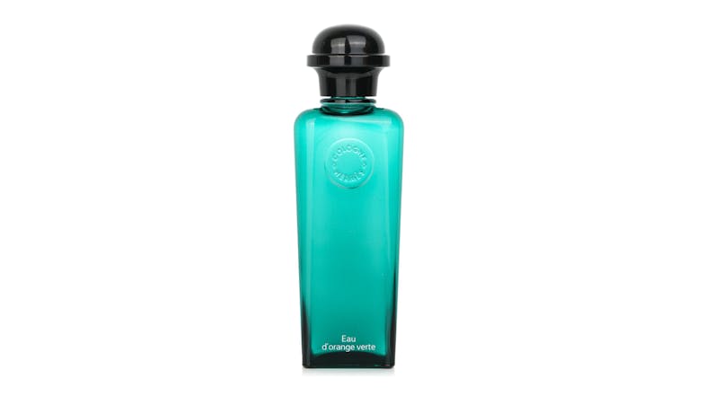 Front view of the Hermes Eau d’Orange Verte cologne spray in a sleek glass bottle with a black cap Front view of the Hermes Eau d’Orange Verte cologne spray in a sleek glass bottle with a black cap